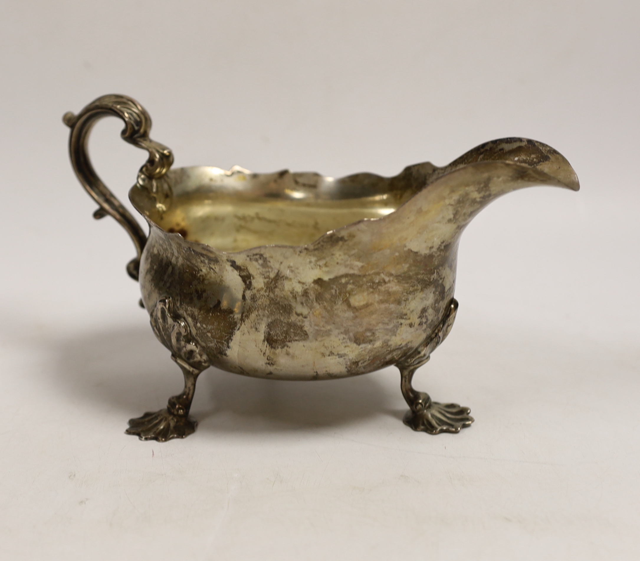 A large late Victorian silver sauceboat, Carrington & Co?, London, 1897, length 21.2cm, 15.9oz.